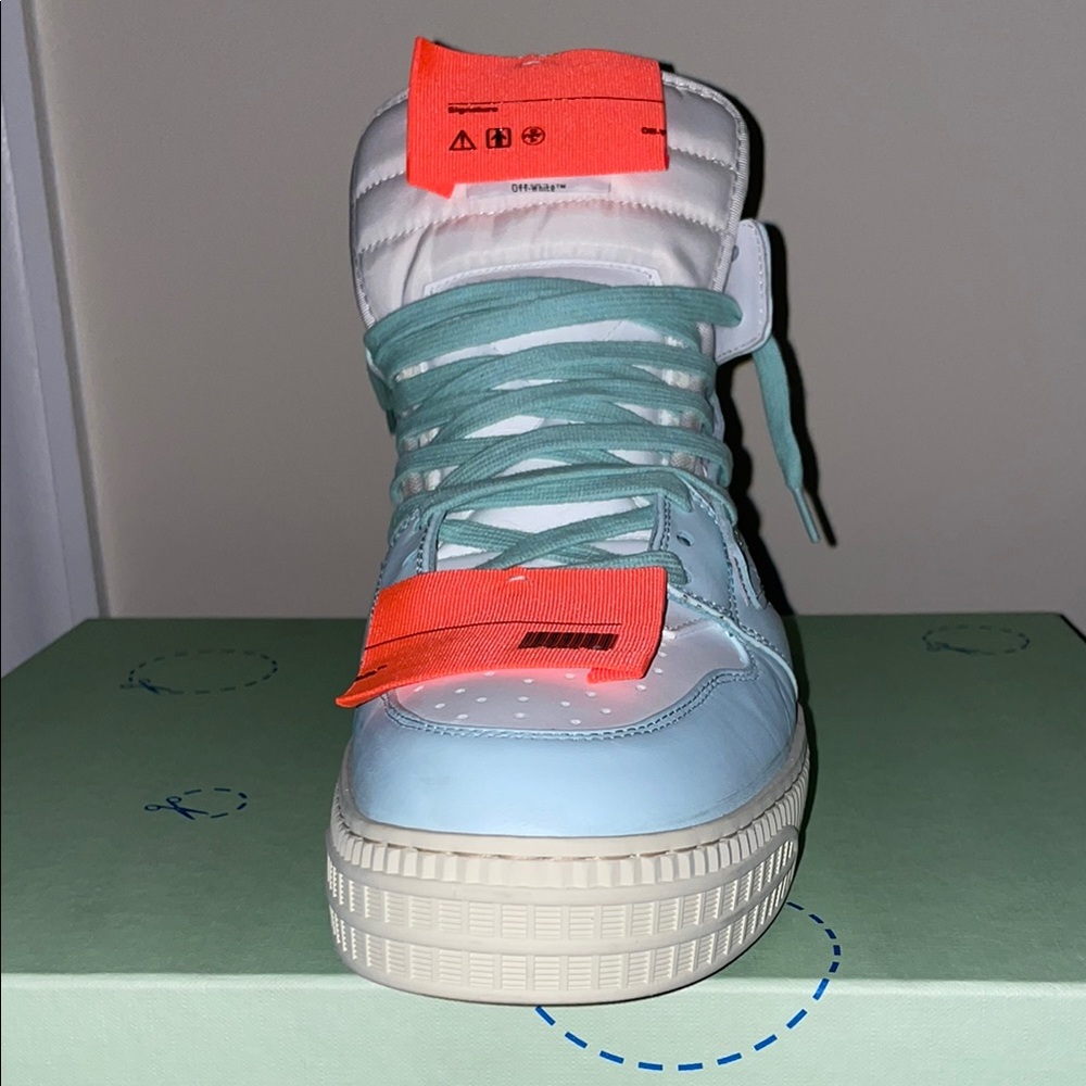 Off-White Sneakers with Orange and Light Blue Accents